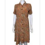 A 1930s summer dress in a ditsy print rayon, a 1940s paisley rayon shirt waist dress, a 1940s