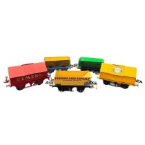 A collection of vintage Hornby tipping wagons to include an early Cement wagon, a Portland Cement