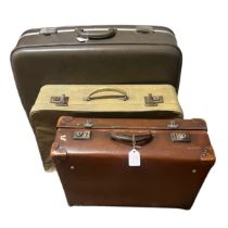 A collection of four mid-century suitcases to include one in tan leather, one in cream mock reptile,
