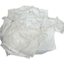 Three white cotton corset covers plus a whitework chemisette and group of children's wear, early