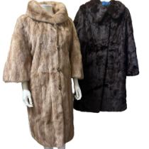 A 1960s mink coat with wide bracelet length sleeves and decorative glass studded buttons lined