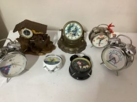 *** to be reoffered in sale 26/3/24*** Vintage novelty clocks to include a very weighty metal old