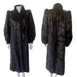 A 1970's long length glossy, dark ranch mink coat in the 30s style with lapels, pockets and