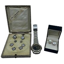 A boxed gents dress set in white metal with mother of pearl, enamel and marcasite from Hall &