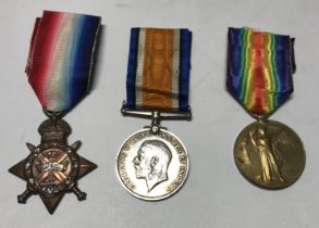 A WW1 1914 Star trio, awarded to L-6864 L/Cpl R.W.Brett of the 1st East Kent Regiment. To include: