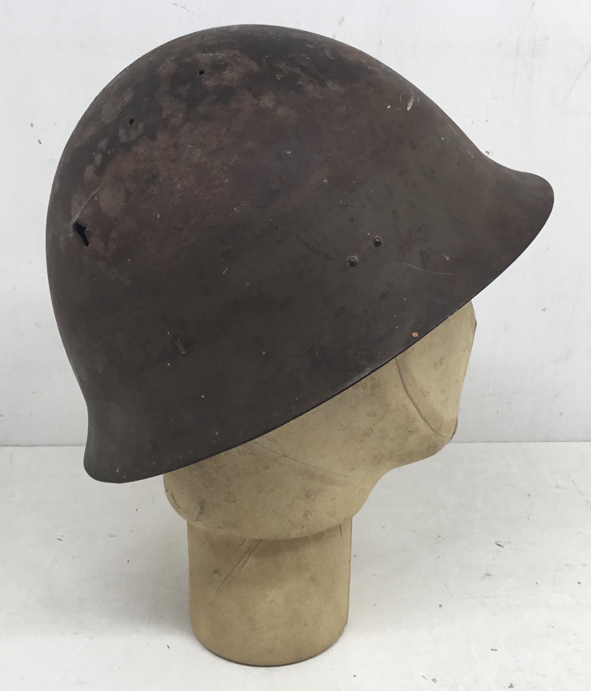 A WW2 era Japanese type 90 battle damaged steel helmet. A semi relic piece, with just the shell - Image 2 of 9