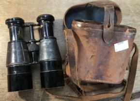 A WW1, possibly earlier, set of binoculars, including leather case of issue. Blackened brass body