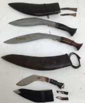Three Kukri presentation knives in original scabbards the larger two possibly Indian Army issued
