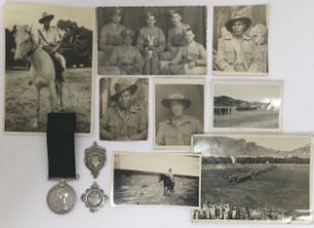 An interwar period Volunteer Long Service Medal, 2 silver prize medallions, and period