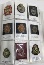 1 x soft cover album of British embroidered cloth and bullion hat / beret badges, plus a few