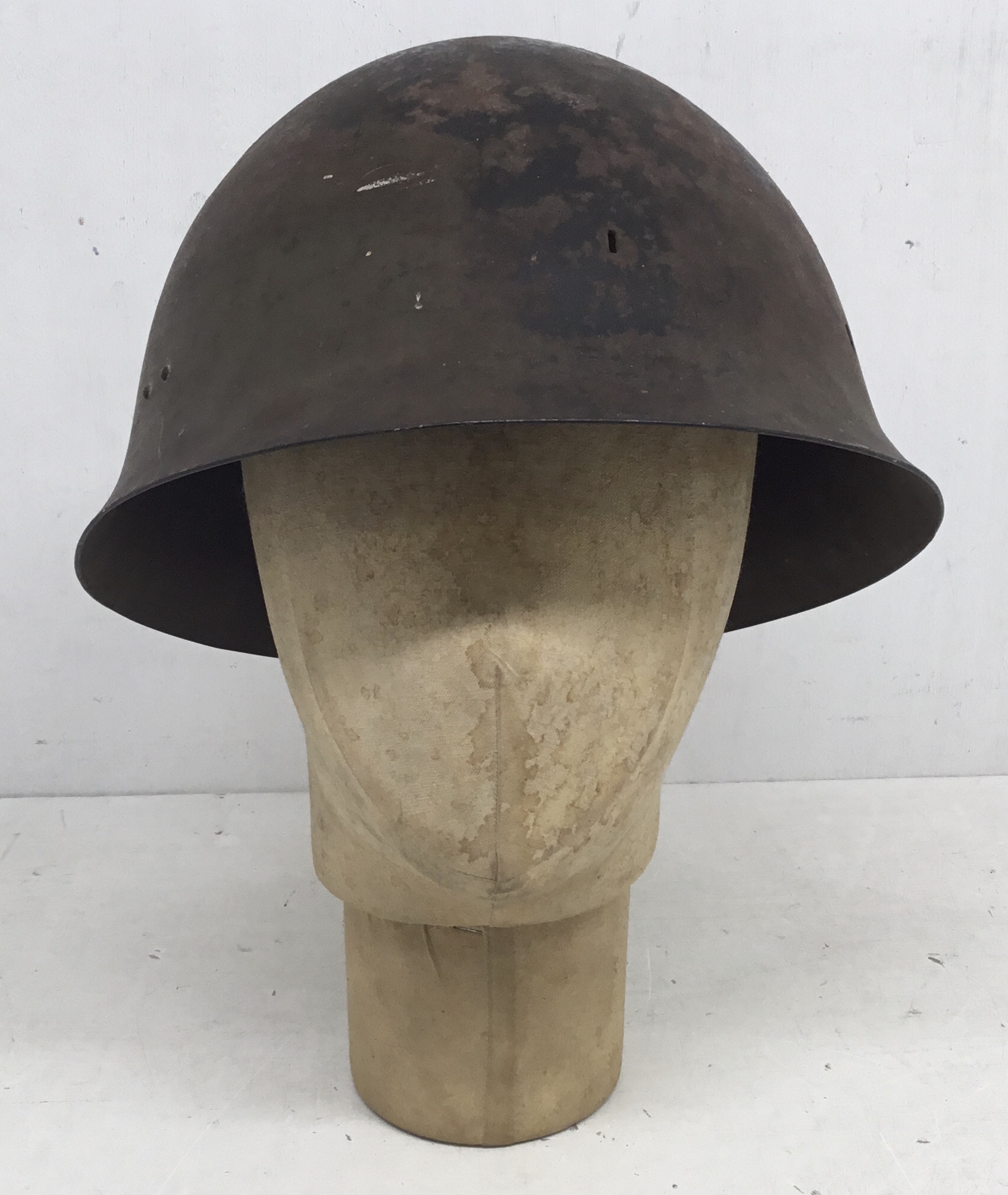 A WW2 era Japanese type 90 battle damaged steel helmet. A semi relic piece, with just the shell - Image 3 of 9