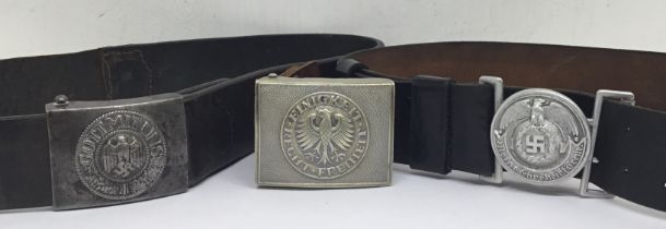 A WW2 German Army buckle, and 2 post war examples. To include: a Heer buckle and belt, maker