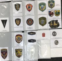 A good selection of British and European Special Forces embroidered patches, printed patches and