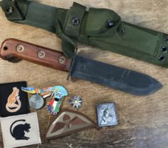 A 1980's British Army survival knife, complete with canvas sheath and frog. Marked with a broad