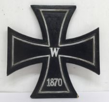 An unusual, large sized wooden 1870 Iron Cross, with wall hanging loop to the reverse side. Of