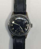 A WW2 era German Wehrmacht issued Grana wristwatch. Black dial with subsidiary dial, and luminescent