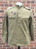 A scarce WW2 era Soviet Russian summer weight tanker jacket, with 2 enamel badges applied to the