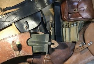 A selection of pistol holsters, magazine pouches, magazines and tools. Including 2 Swedish examples,