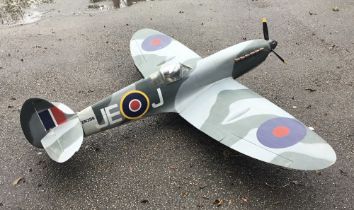 A large scale model of a WW2 Spitfire fighter plane. Likely constructed in the latter part of the