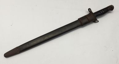 A WW1 era, United States M1917 bayonet, complete with scabbard. Standard double groove cut walnut