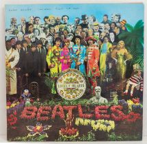 The Beatles - Sgt Peppers Lonely Hearts Club Band. The album sleeve only - Signed on the top by `