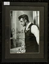 Robbie Williams Signed Black and white photo. This unique photograph was given to the vendor by Pete