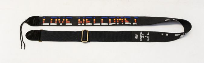 U2 limited edition guitar strap. The Edge X-love welcomes #1021 Given to crew member on tour.