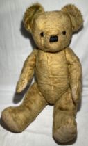 Teddy Bear: A mid 20th century vintage teddy bear, possibly English. 24”, fully jointed, glass eyes,