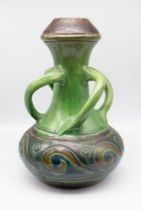 An early 20th century Continental probably Belgian pottery vase, of globular form with four spiral