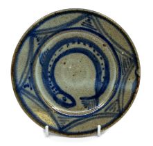 Abuja pottery, Nigeria small plate with blue fish design on a green ground. Diameter approx 16.7cm.
