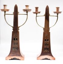 A pair of Continental probably German Arts & Crafts copper candlesticks, in the style of WMF, both