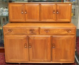 Ercol - a "Windsor" buffet sideboard, the base section with three doors with two drawers above an