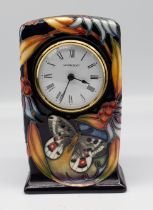 Moorcroft Pottery - an 'Apollo' patterned mantel clock, impressed marks to base, designed by Sian