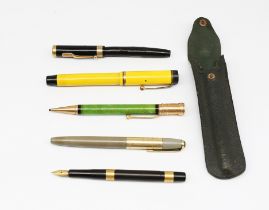 A collection of 20th century pens to include; a Parker Lady Duofold fountain pen in mandarin yellow,