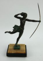An Art Deco bronzed figure of Diana the Hunter on an onyx and slate stand. Indistinctly signed.