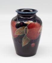 A miniature vase by Moorcroft Pottery in the Pomegranate design. Impressed and painted marks to