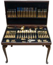 A Solingen German twelve-place 24kt gold-plated canteen table on four detachable legs, including all