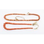 Two antique coral bead necklaces, to include a graduated off round bead necklace, the largest