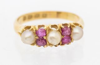 A Victorian ruby and pearl set 18ct gold ring, comprising three pearls with oval and rectangular cut