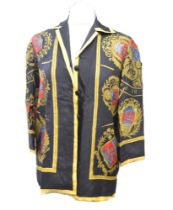 An Hermes black silk jacket from the 1950s, the centre of the jackets bears a medallion of a galleon