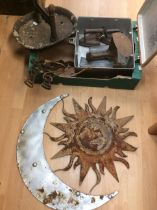 A collection of metal wares, i.e. irons, shoe iron, strong box, moon and sun wall hanger and a