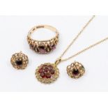 A collection of garnet and 9ct gold jewellery to include a ring set with three graduated oval