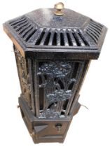 A modern freestanding electric stove made of metal and ceramic in a floral design.