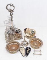 A small collection of silver plated items to include; an ornately designed plated three decanter