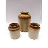 Three stoneware jars.