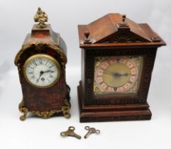 A late 19th century tortoiseshell style cased mantel clock, with gilt metal cabriole feet, cast