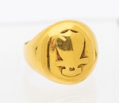 A French? yellow gold signet ring, the oval front cast with symbol possibly Masonic, width approx