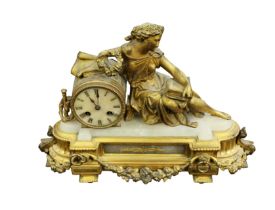 A 19th Century French gilt metal and white marble mantle clock with drum face, Roman numerals, 8 day