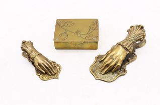 Two 19th century hand shaped paper clips and an Art Nouveau Gesch German brass stamp box. (3)