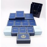A collection of fourteen boxed Halcyon Days enamelled boxes to include; Born to Shop, With love from